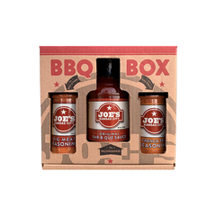A gift box labeled Joe's Kansas City Bar-B-Que with a bottle of BBQ sauce, a container of big meat seasoning, and a container of fry seasoning.