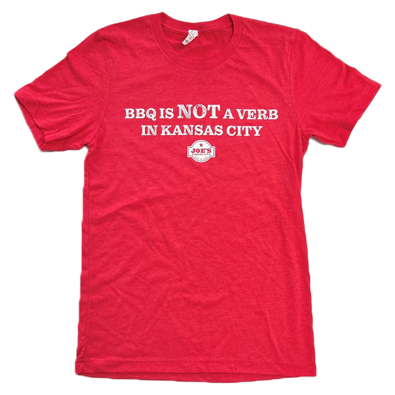 Kansas City BBQ T-shirt featuring the slogan "BBQ Is Not a Verb in Kansas City" on a red graphic tee, perfect for barbecue lovers and KC BBQ fans.